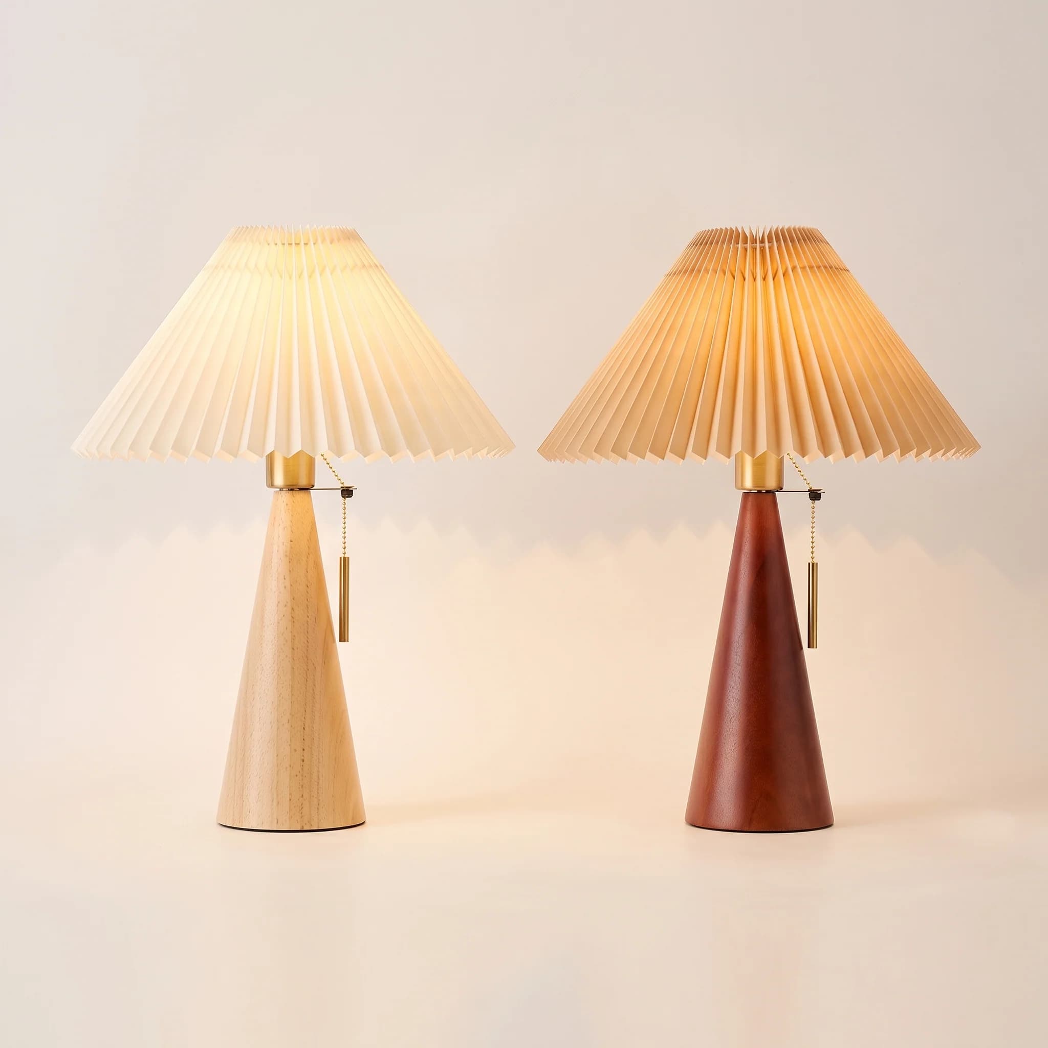 Piega — Pleated Shade Table Lamp, lit in a dark room